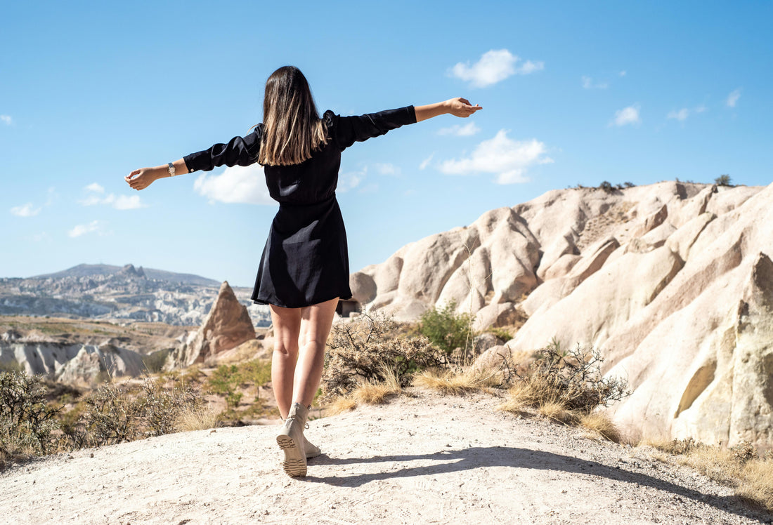 Woman enjoying a sunny summer afternoon outdoors, relaxing and embracing mindfulness in the warm weather