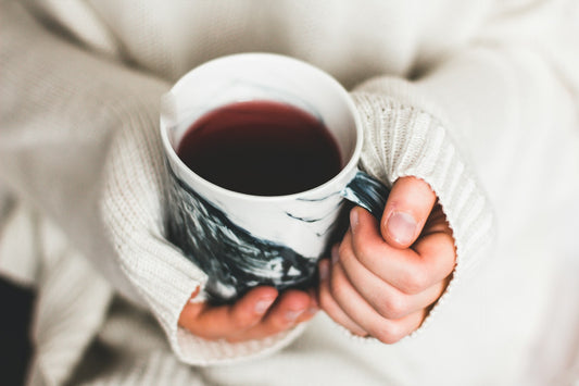 Woman holding mushroom coffee
