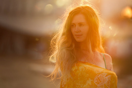Woman in summer bathing suit orange glow