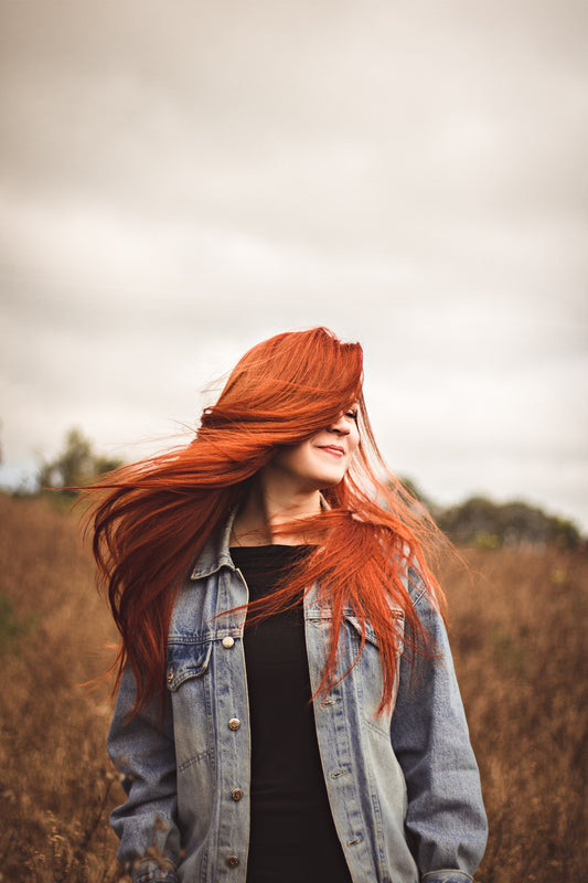 Woman with red hair in Autumn