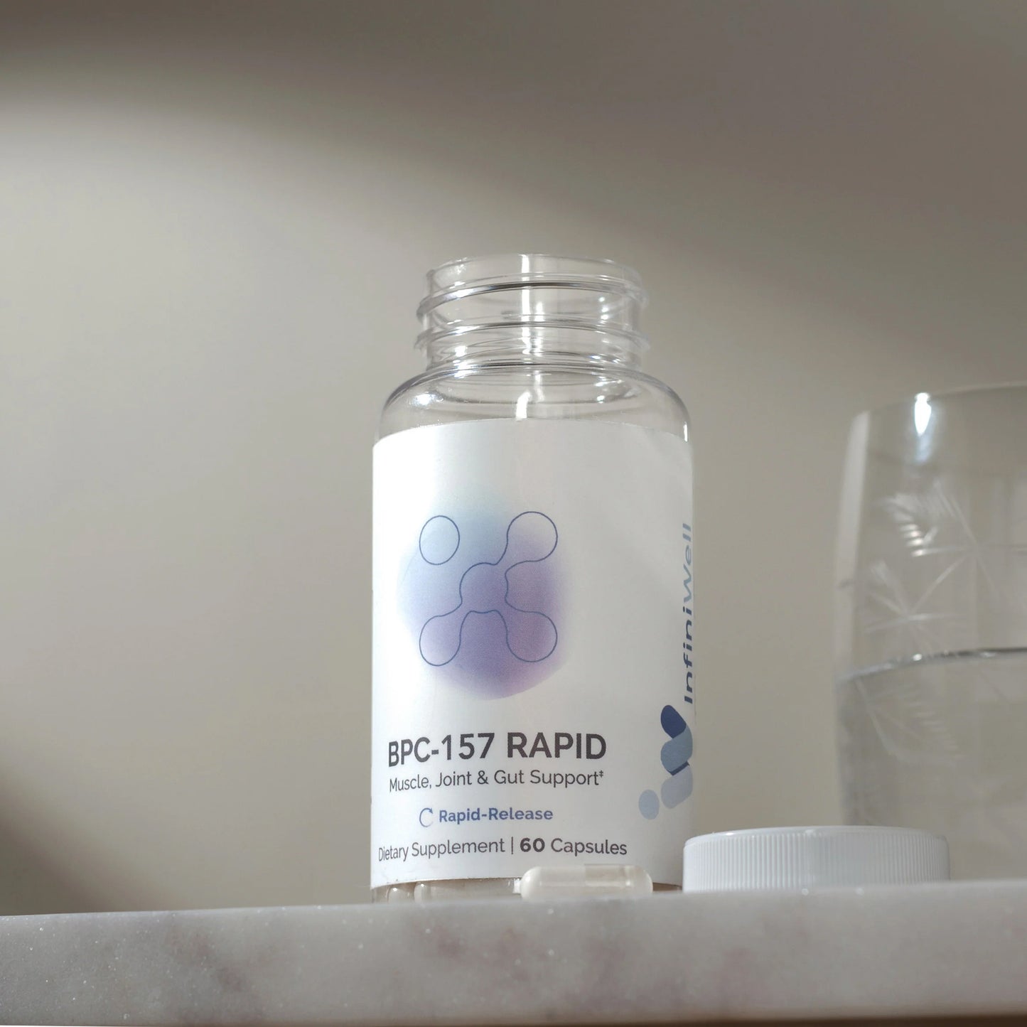 Bottle of BPC-157 Rapid supplement on a marble surface with a neutral background