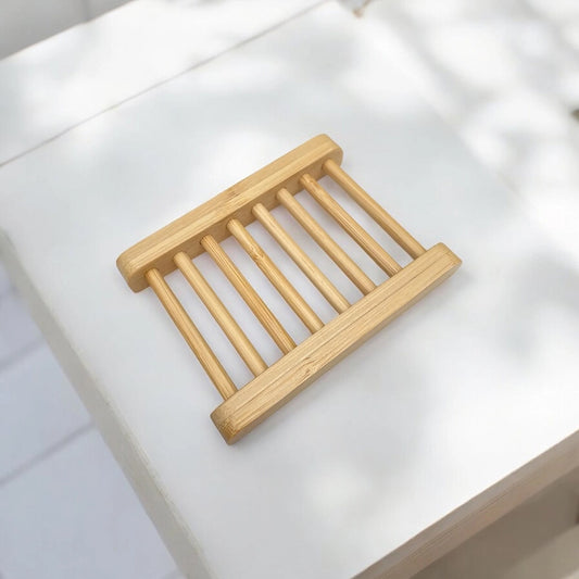 Bamboo soap dish on a white surface