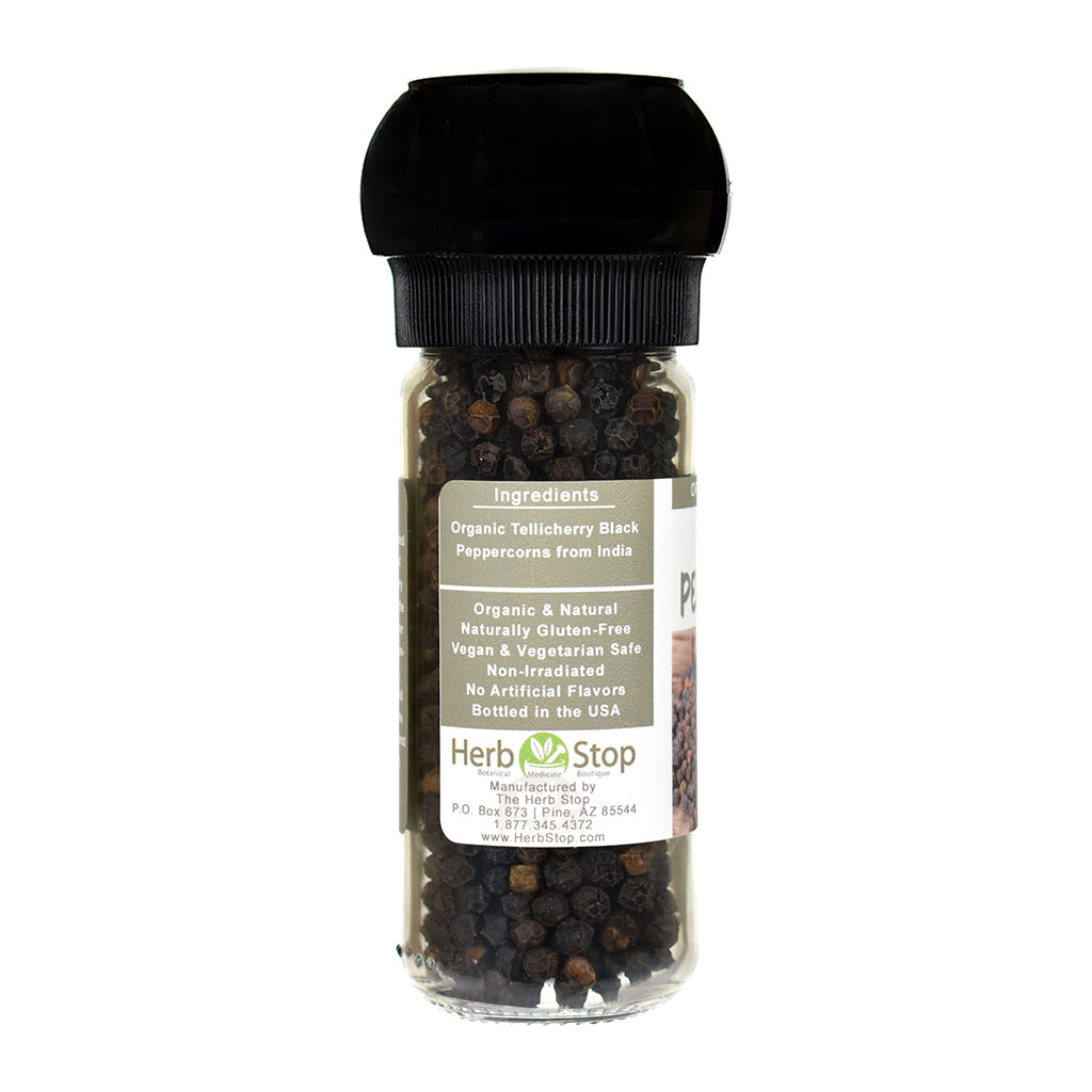 Bottle of black peppercorns with a label on a white background