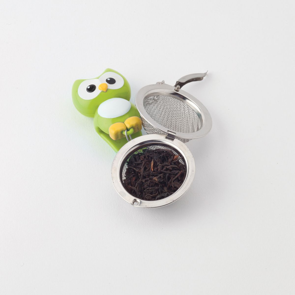 Tea infuser with owl design on a white background