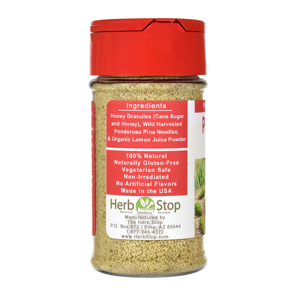 Pine Needle Sprinkle spice jar with red lid and label on a white background