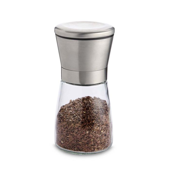Clear pepper grinder with silver top on a white background