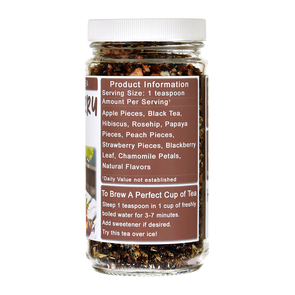 Jar of Strawberry Peach tea with a label detailing ingredients and brewing instructions on a white background