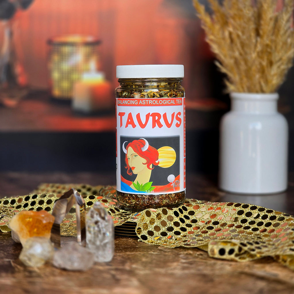 Jar of Taurus Astrological Tea on a decorative table with crystals and fabric.
