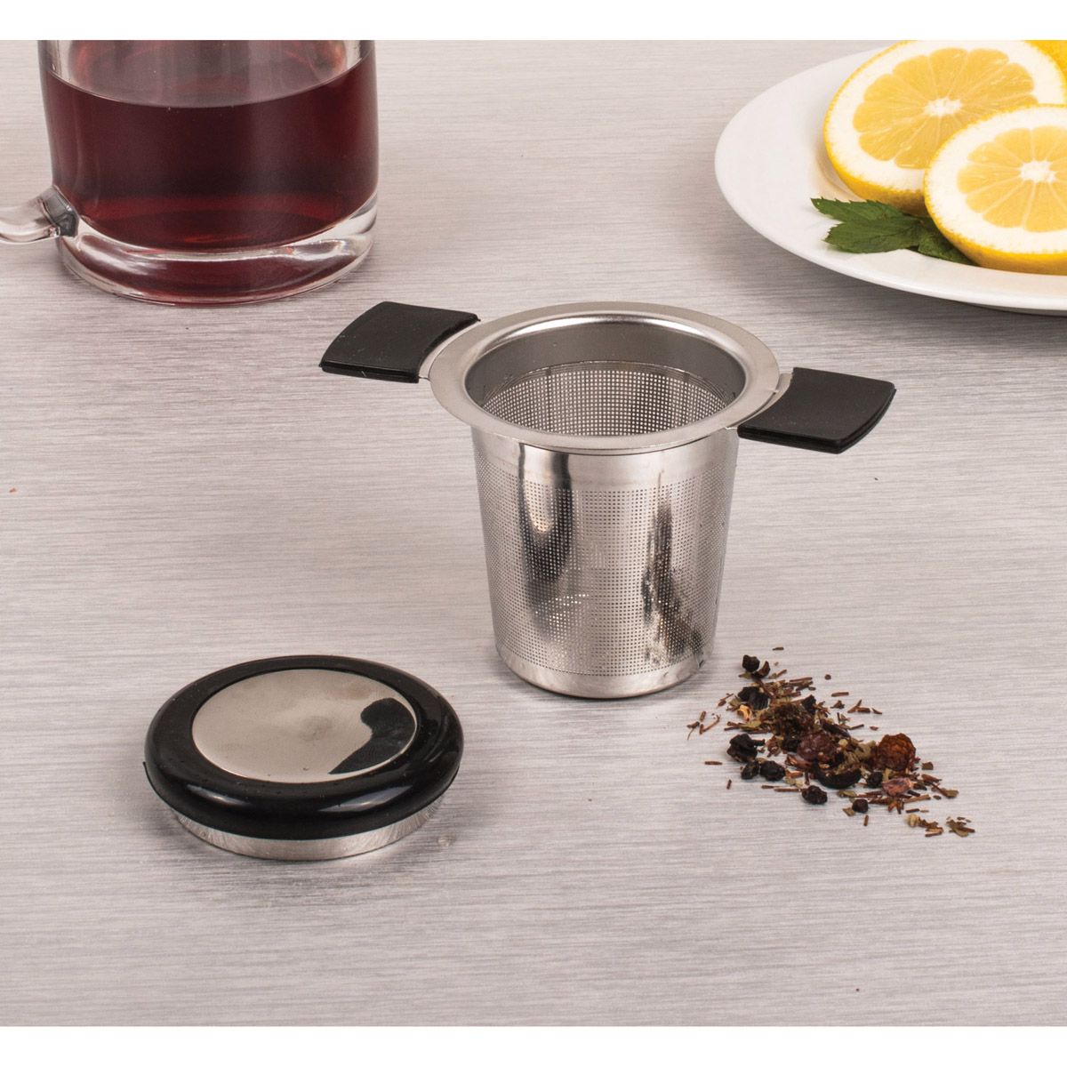 Brew in Mug Tea Infuser with loose leaf tea, lemons and tea cup