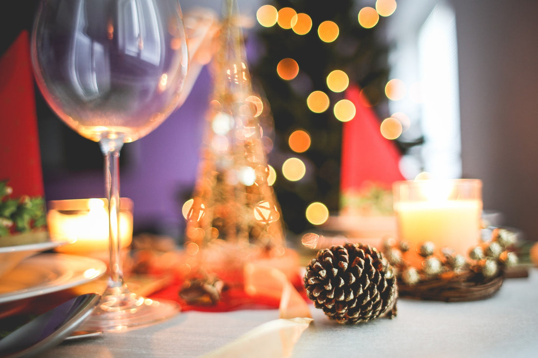 Christmas dinner table with wine glass