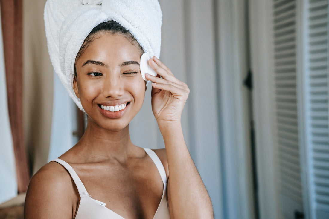 Woman cleaning her face