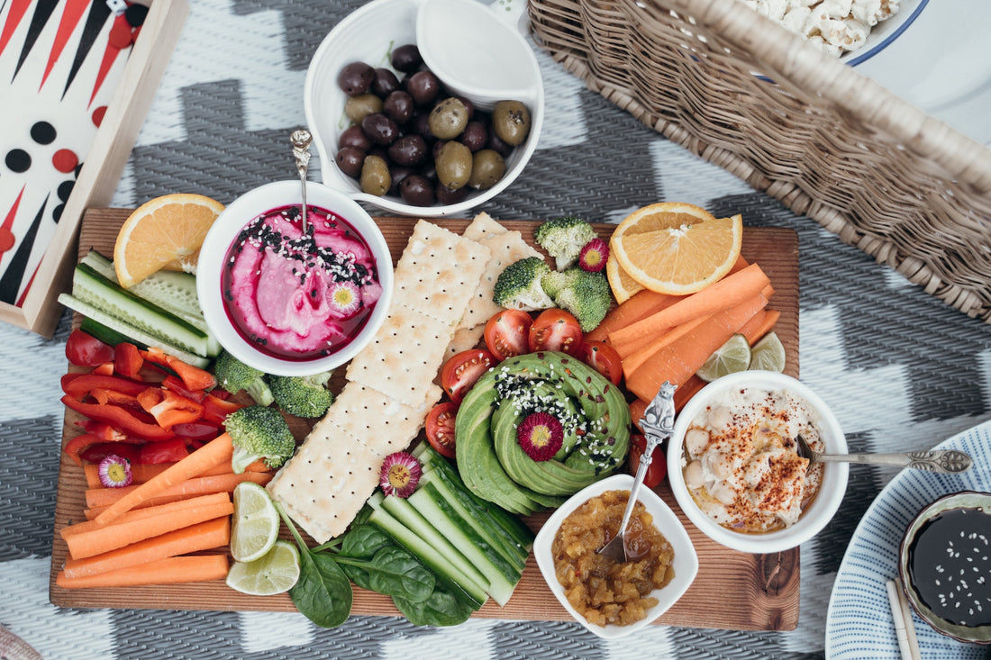 Charcuterie board with fresh veggies and dips