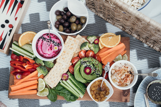 Charcuterie board with fresh veggies and dips