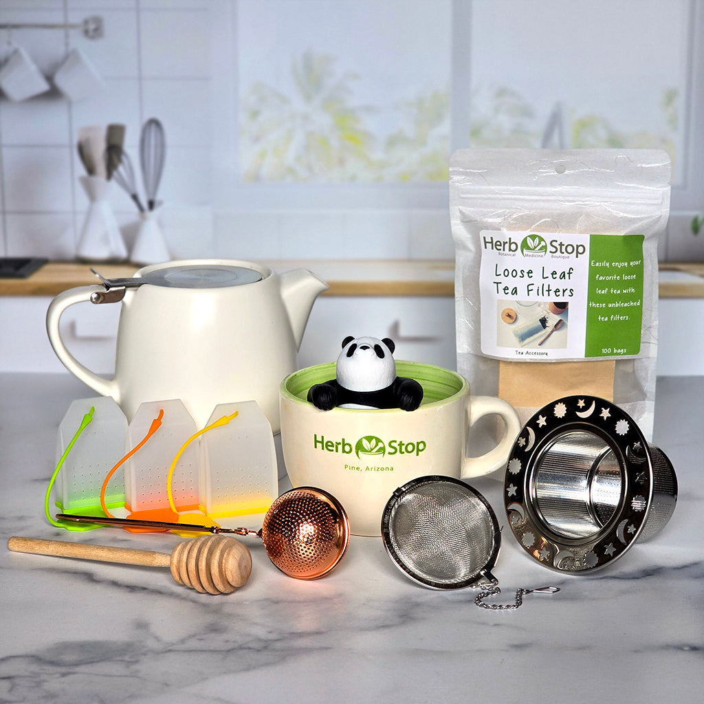 Loose Leaf Tea Accessories on a marble counter with a kitchen background