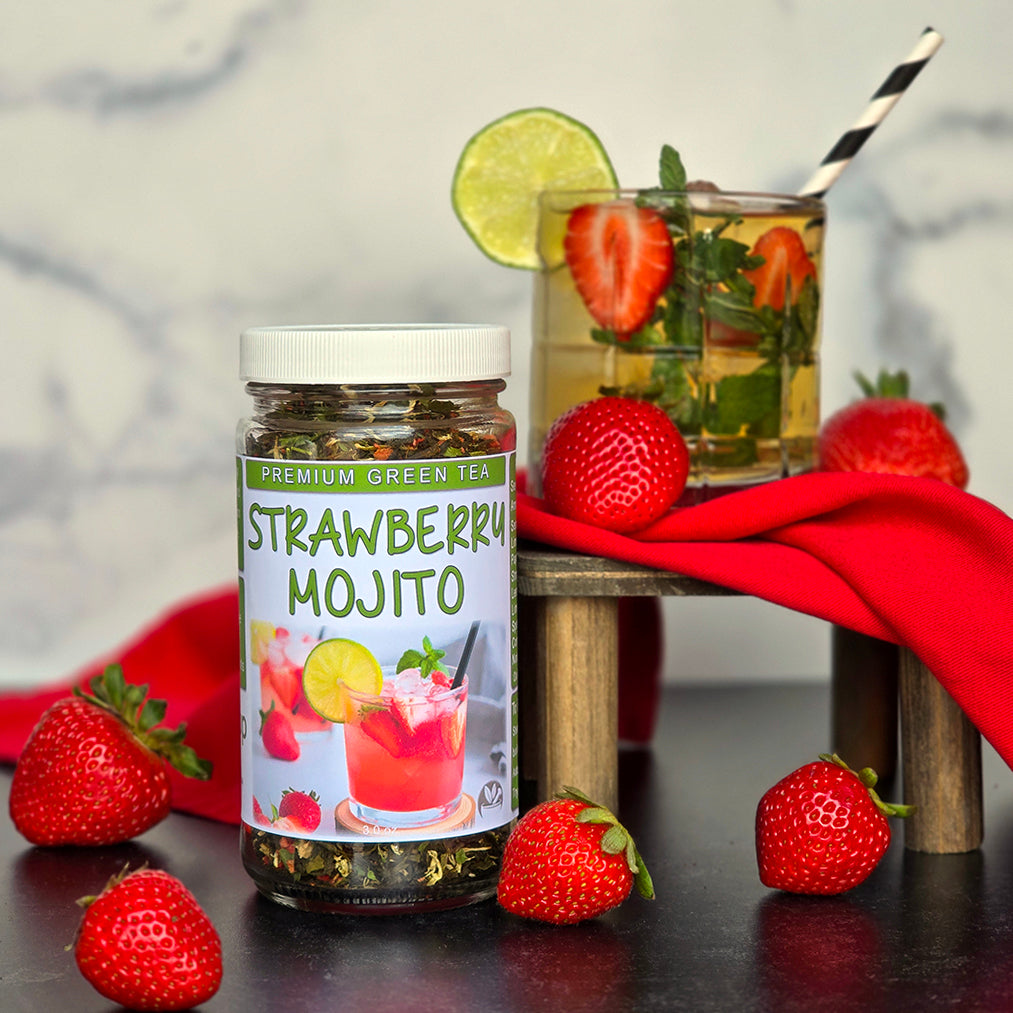 Strawberry Mojito Green Tea with an ice tea glass and strawberries