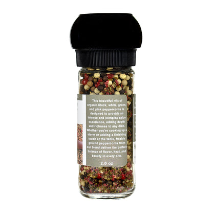 Spice grinder with colorful peppercorns on a white background
