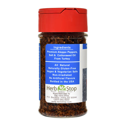 Bottle of Herb Stop Aleppo Pepper with red cap on a white background