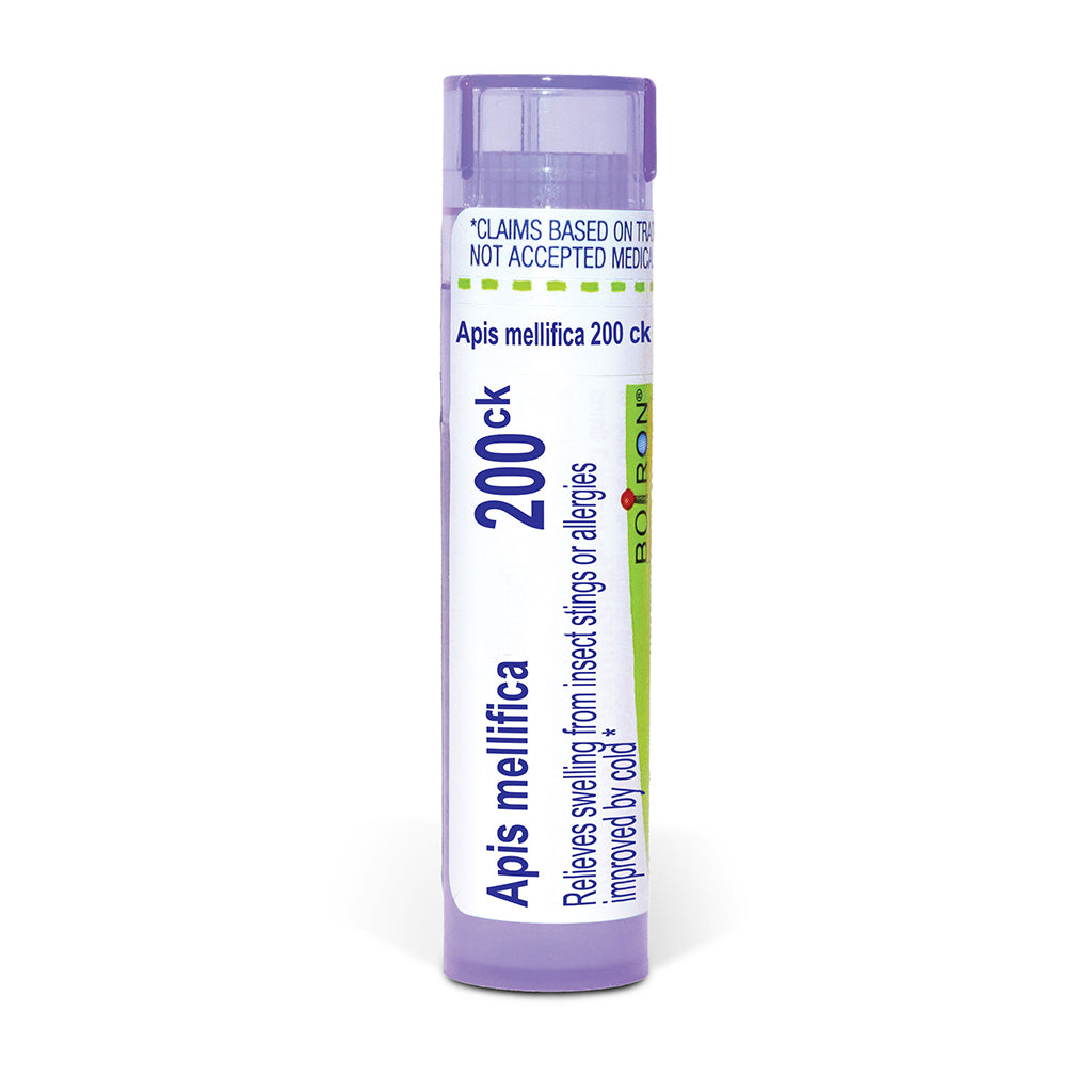 A single tube of Apis mellifica 200ck insect sting or allergy relief pellets, featuring a white label with blue and green text and a light purple cap, set against a plain white background.