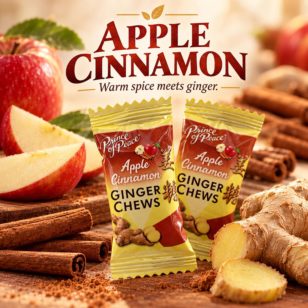 Two packages of Prince of Peace Apple Cinnamon Ginger Chews displayed on a rustic wooden surface with sliced apples, cinnamon sticks, ginger root, and the text 'APPLE CINNAMON Warm spice meets ginger' at the top.