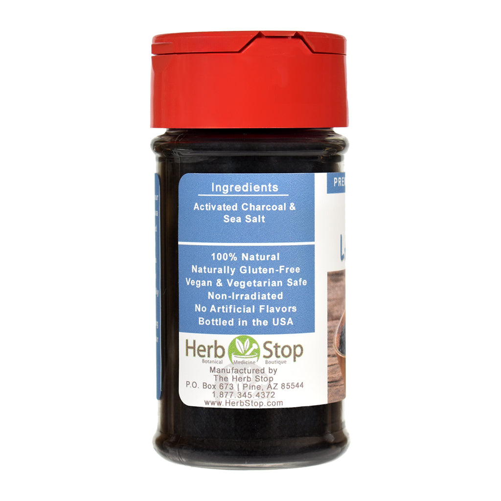 Bottle of black lava salt with red cap and label detailing ingredients.
