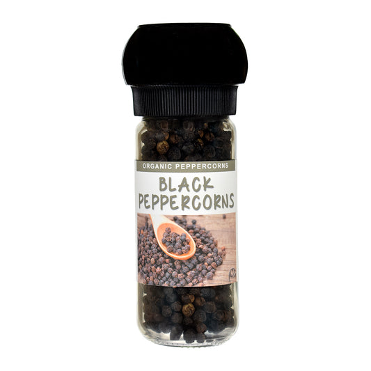 Organic Black Peppercorns with a grinder lid on a white background