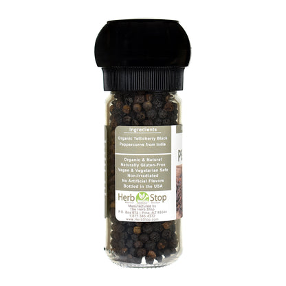 Bottle of black peppercorns with a label on a white background