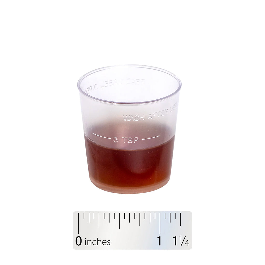 Clear measuring cup with Nature's Way Bronchial Soothe liquid and a ruler for scale on a white background