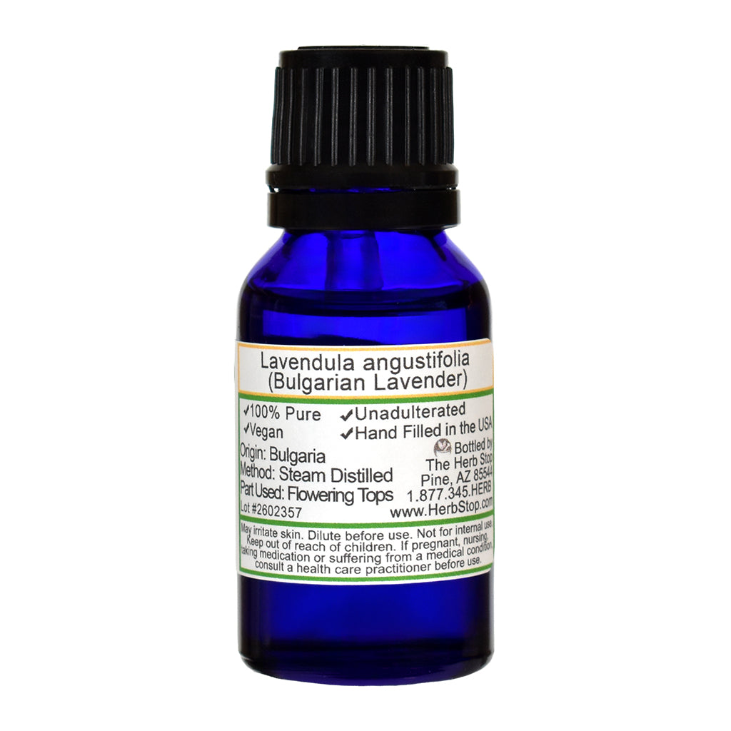 Blue bottle of Bulgarian Lavender oil with a label on a white background
