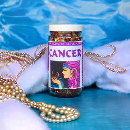 Jar of Cancer astrological tea with decorative pearls and fur on a blue and water background