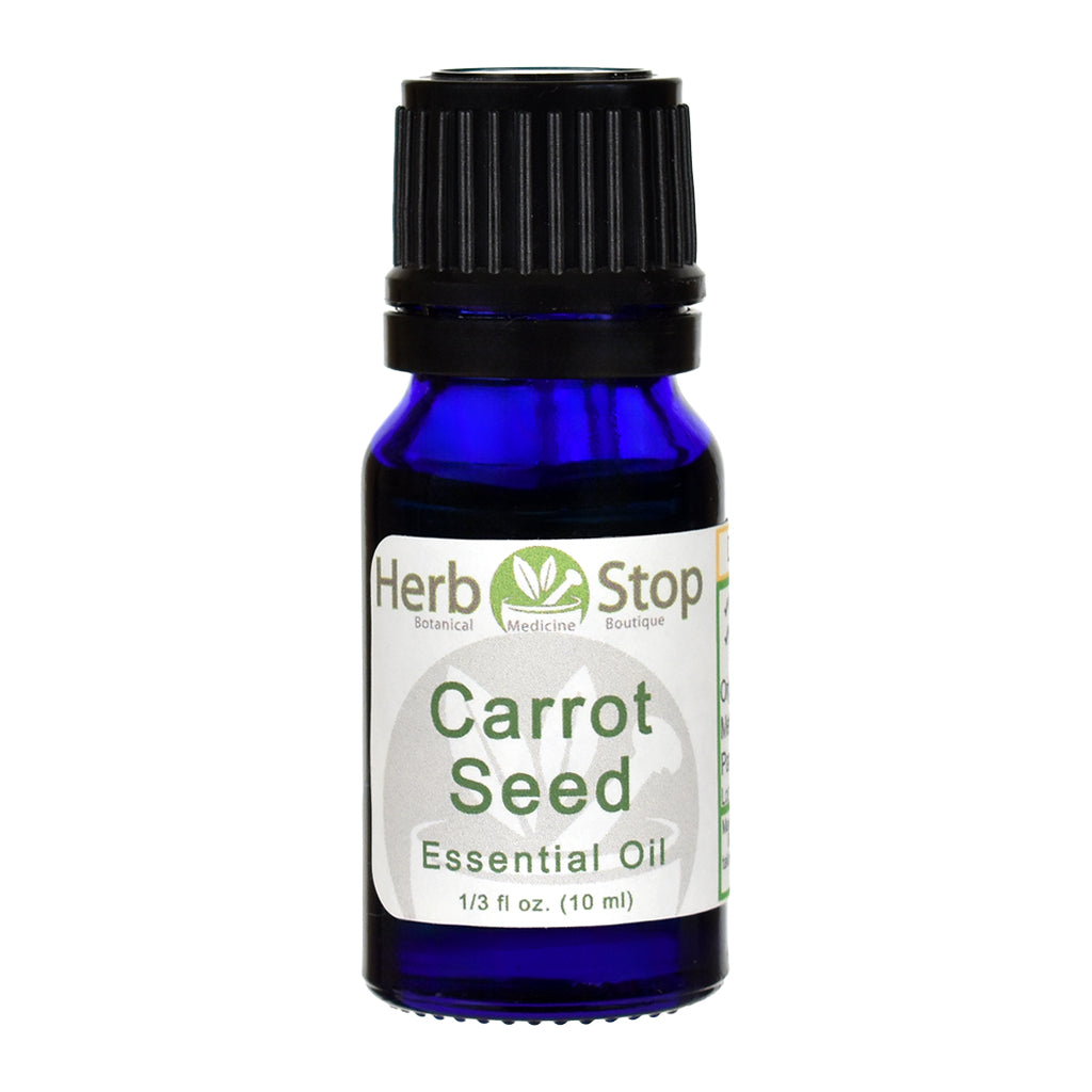 Bottle of Herb Stop Carrot Seed Essential Oil on a white background