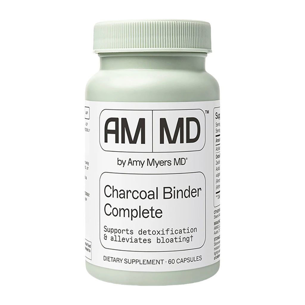 Supplement bottle labeled AM MD by Amy Myers MD Charcoal Binder Complete on a white background