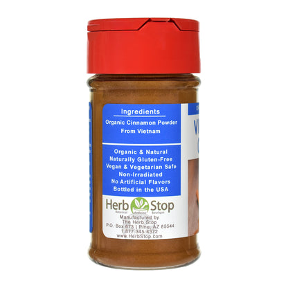 Organic Vietnamese Cinnamon Powder in a spice jar with a red lid