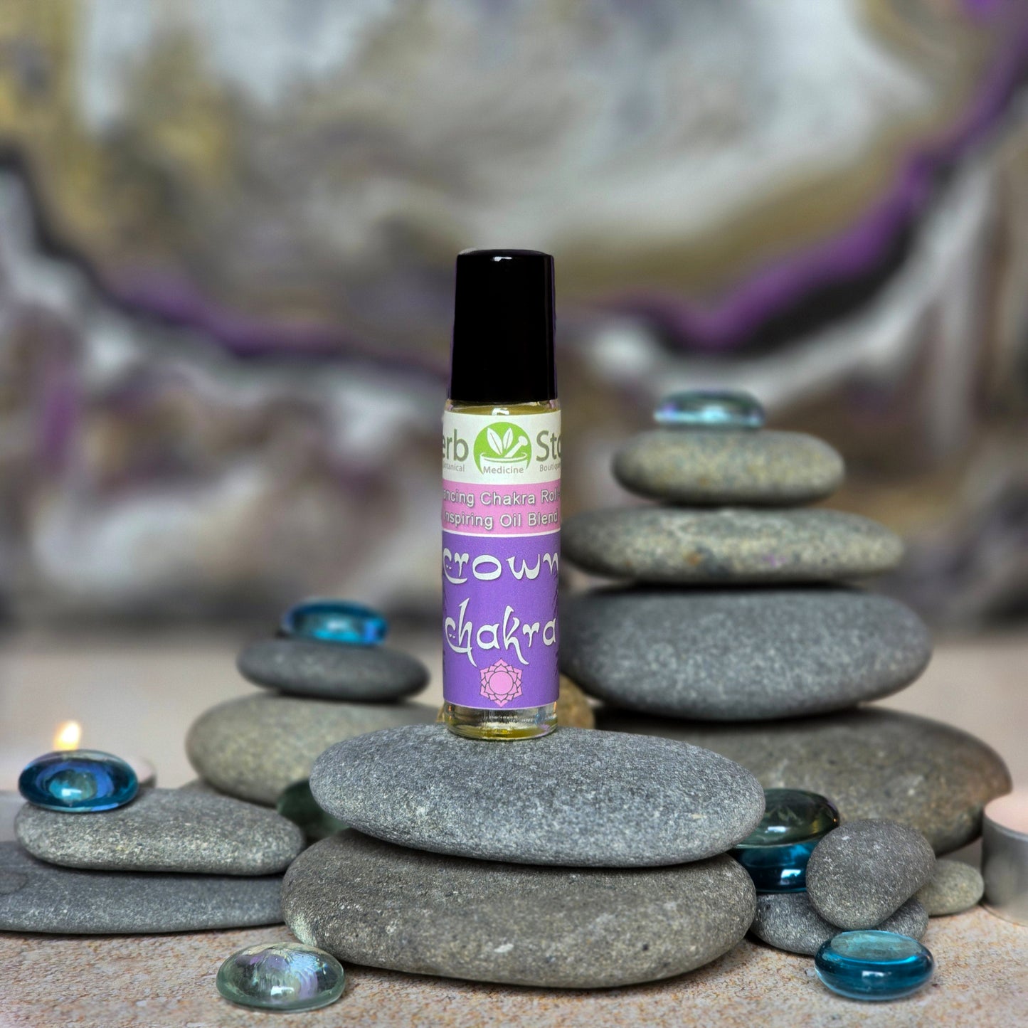 Crown Chakra Aromatherapy Roll-On on pebbles