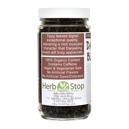 Jar of Darjeeling black tea leaves with Herb Stop label on a white background