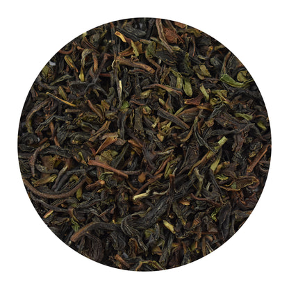 Close-up of Darjeeling tea leaves on a white background