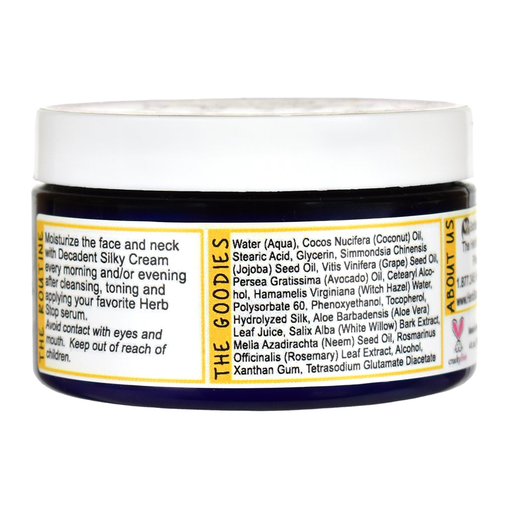 Jar of Decadent Silky cream with a detailed label on a white background