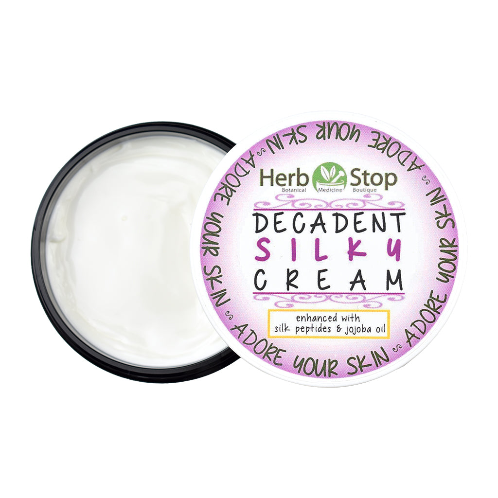 Decadent Silky Cream Jar that is open on a white background