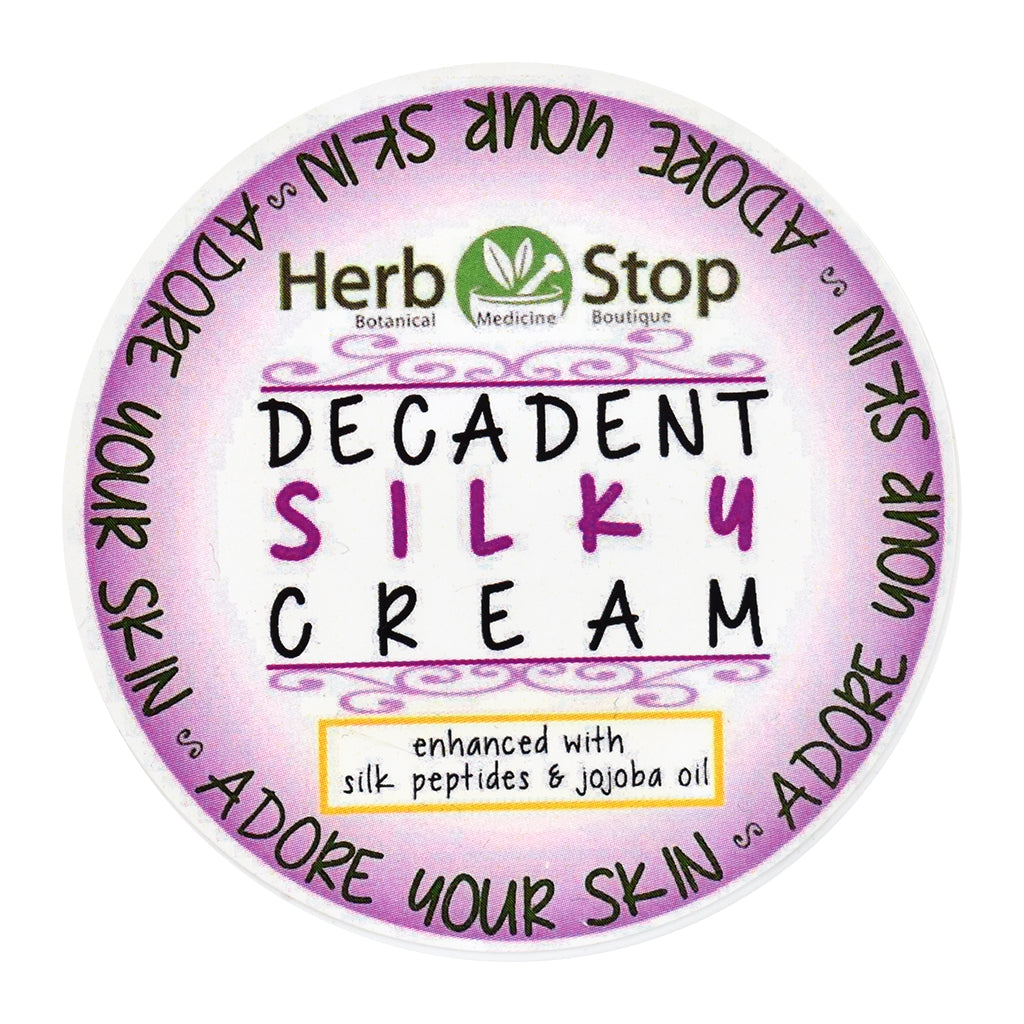 Container of Herb Stop Decadent Silky Cream with purple label on white background