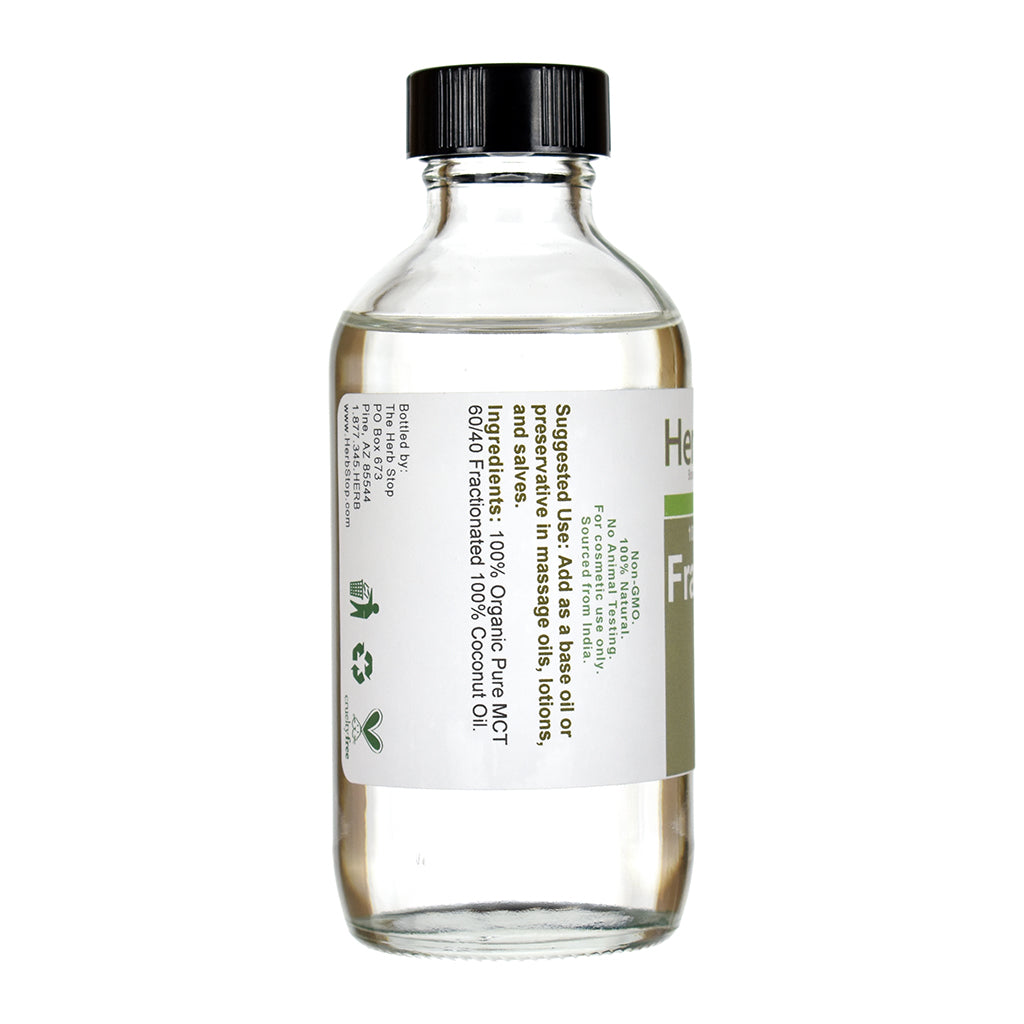 Bottle of Herb Stop Fractionated Coconut Oil on a white background