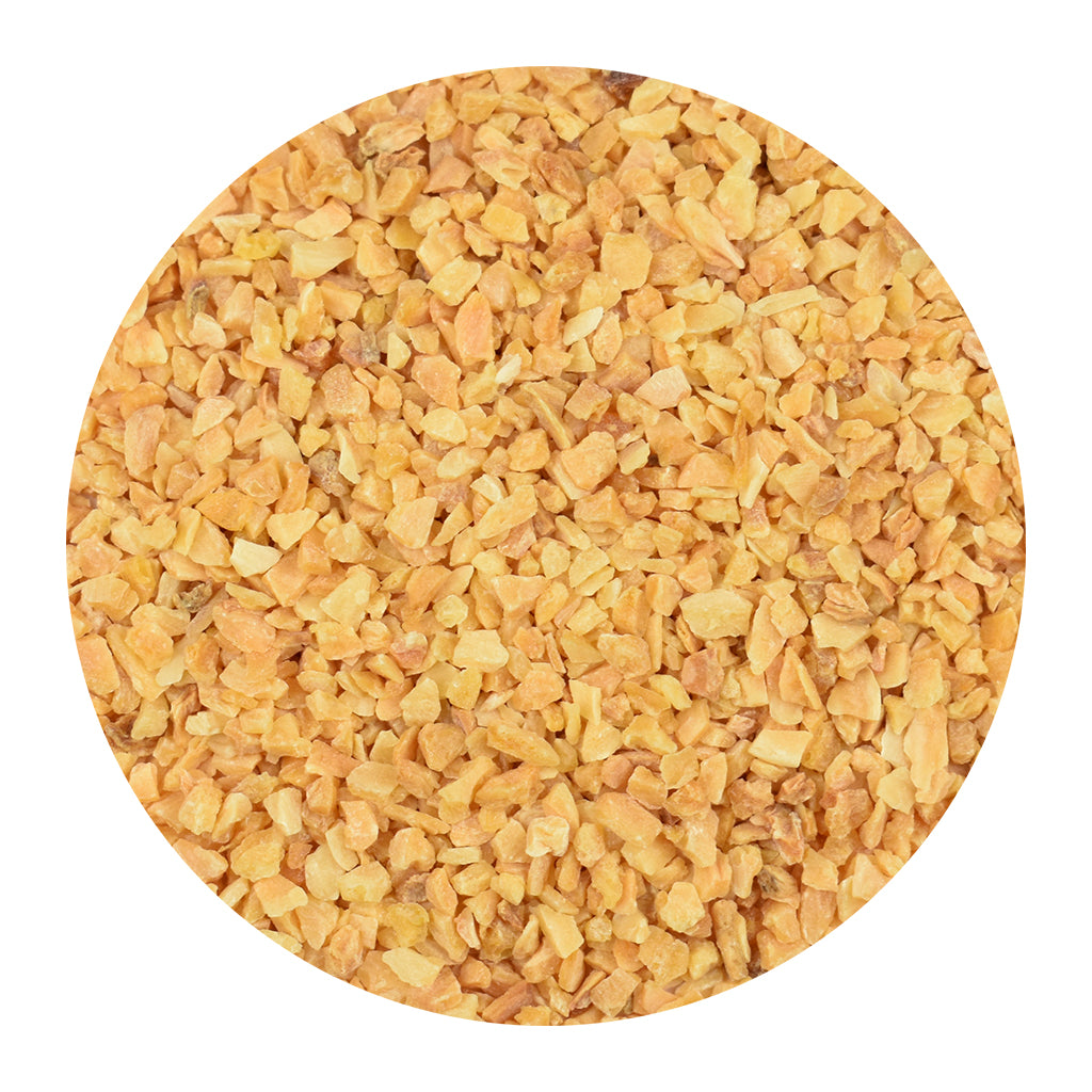 A circular close-up of minced garlic on a plain white background.