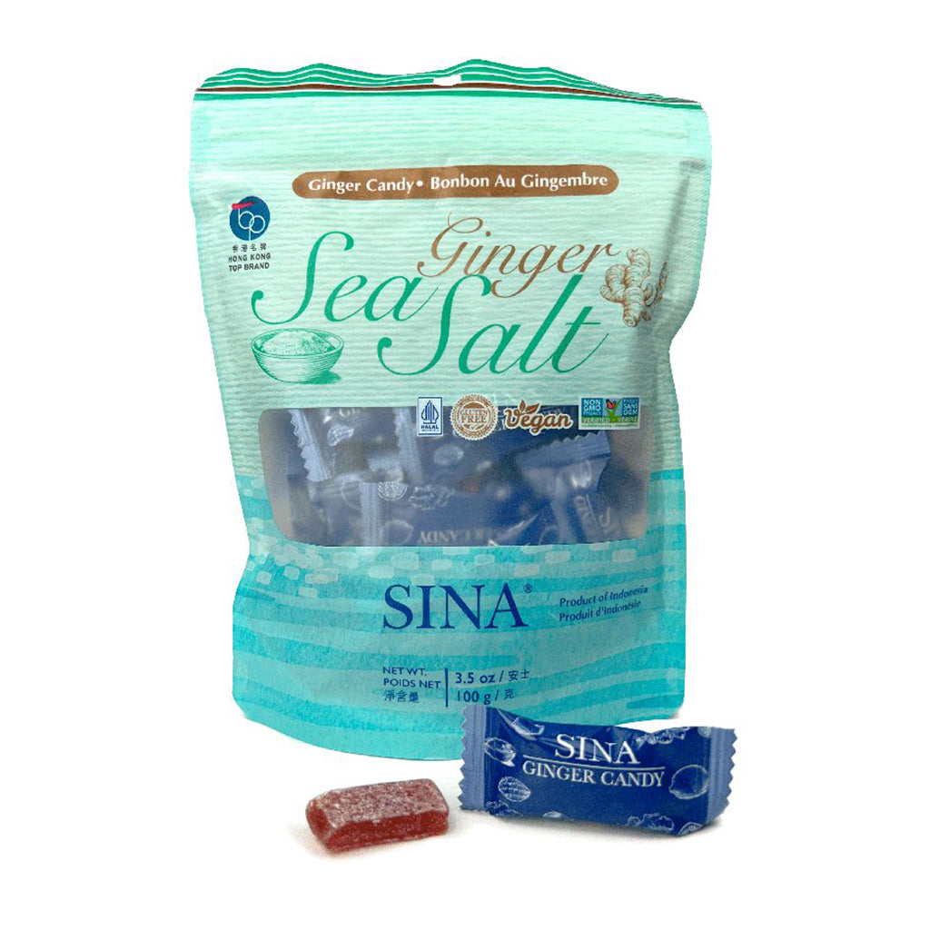 A bag of Sina Ginger Sea Salt ginger candy with two individual pieces of candy shown in front, on a plain white background.