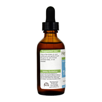 Brown glass bottle with dropper labeled  Gum Toner II on a white background