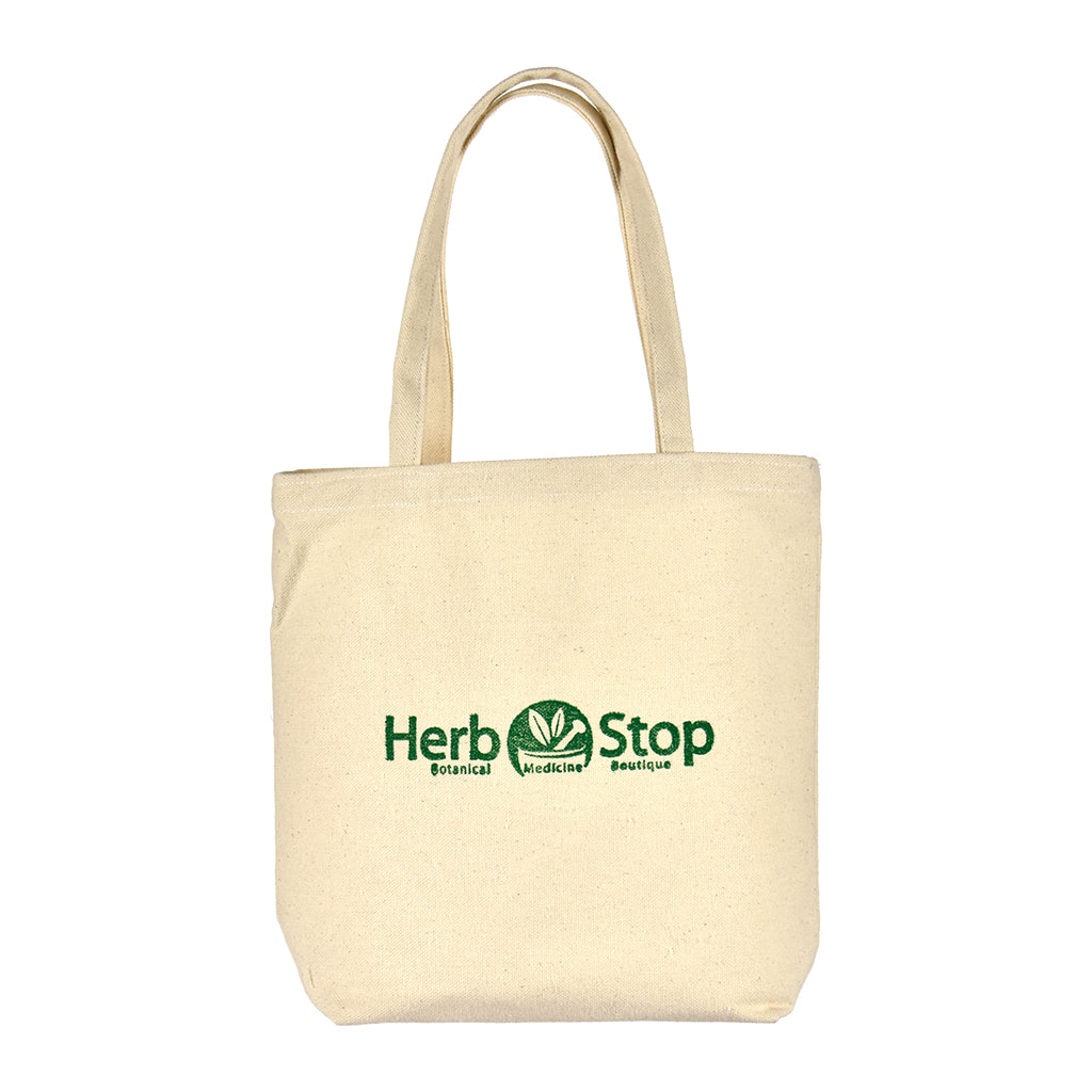 Beige tote bag with 'Herb Stop' logo on a white background