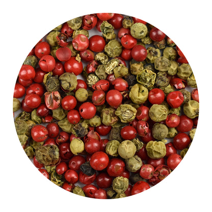 Close-up of pink and green peppercorns on a white background