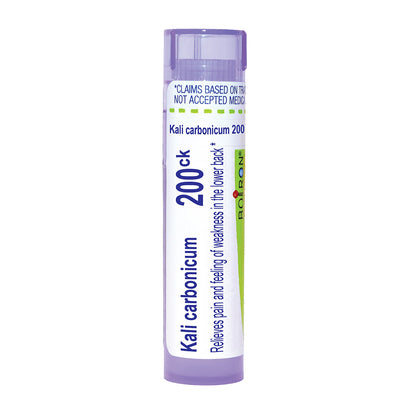 A single tube of Boiron Kali carbonicum 200ck homeopathic medicine, featuring a white label with blue and green text and accents, and a light purple cap and base, on a solid white background.