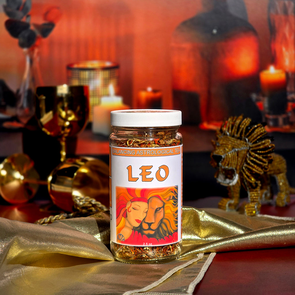 Leo Astrological Tea Jar with decorative items in the background on a gold cloth
