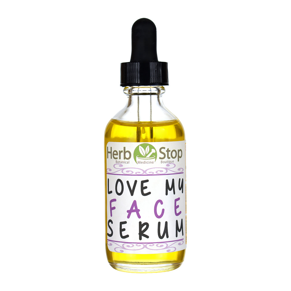 Bottle of 'Love My Face Serum' with a dropper on a white background