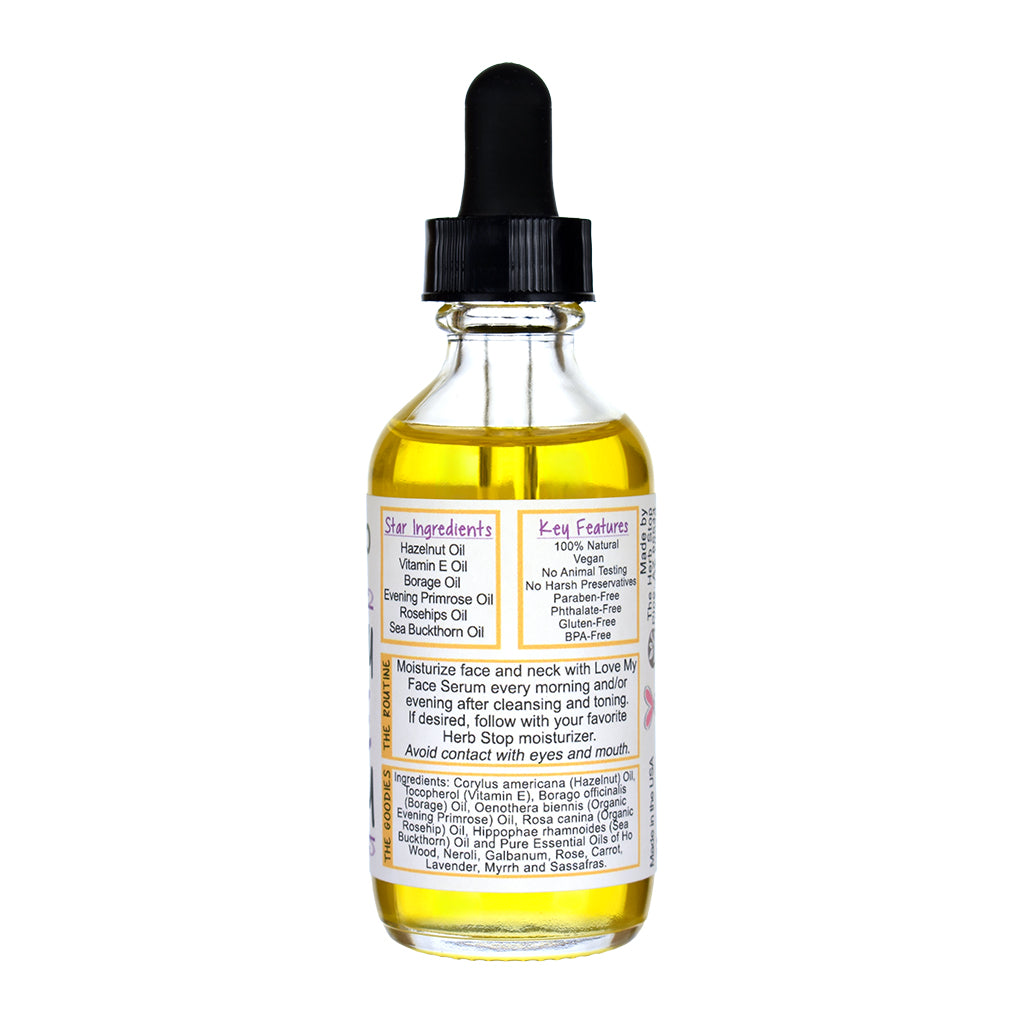Glass bottle with dropper labeled 'Love My Face Serum' on a white background