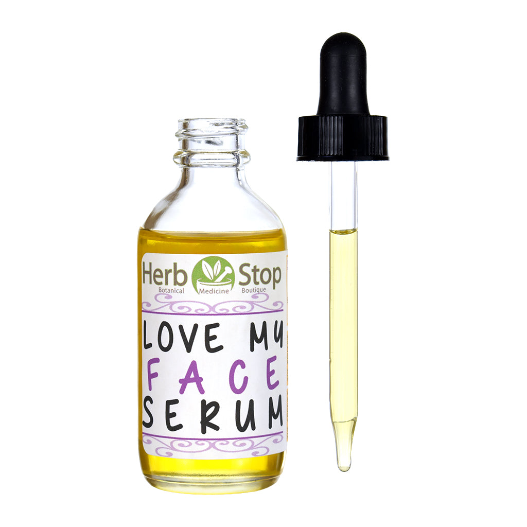Herb Stop Love My Face Serum bottle with dropper on a white background