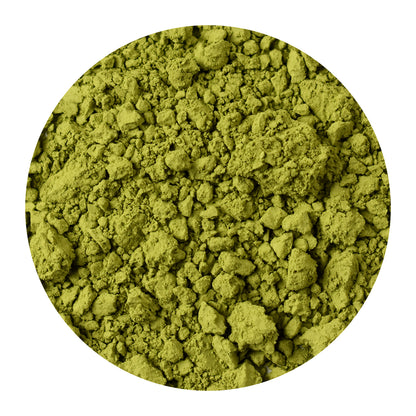 Close-up of organic matcha powder on a white background